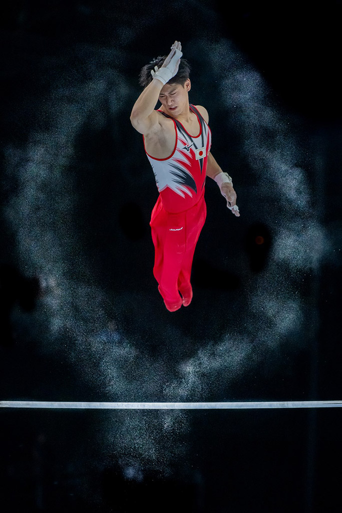 Japanese Gymnast Daiki Hashimoto at the Bars capture mid air by Eric T'Kindt winner of world sports phoography awards 2024