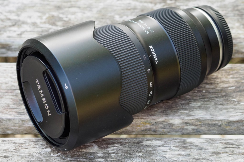 Tamron 50-300mm f/4.5-6.3, packed up with caps and hood reversed