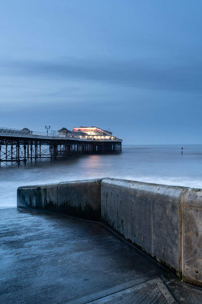 Adobe Super resolution seascape after sunset with a pier and a theatre