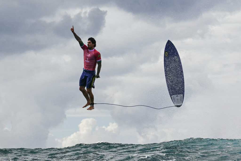 TOPSHOT - Brazil's Gabriel Medina reacts after getting a large wave in the 5th heat of the men's surfing round 3, during the Paris 2024 Olympic Games, in Teahupo'o, on the French Polynesian Island of Tahiti, on July 29, 2024. (Photo by Jerome BROUILLET / AFP) (Photo by JEROME BROUILLET/AFP via Getty Images)