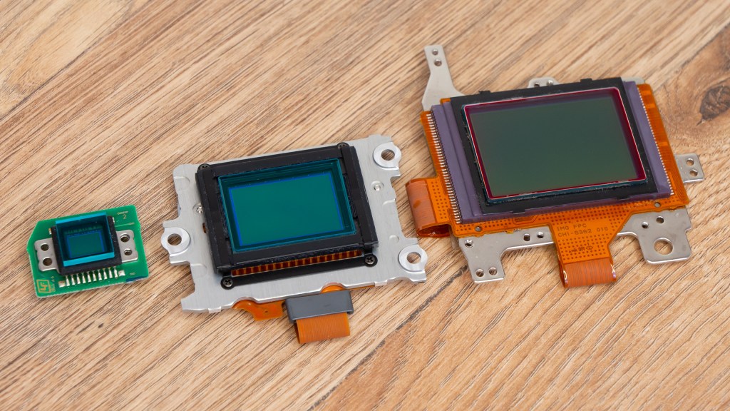 From left to right: 1/1.8inch compact camera sensor, APS-C (Nikon) sensor, Full-Frame sensor. Photo Joshua Waller / AP