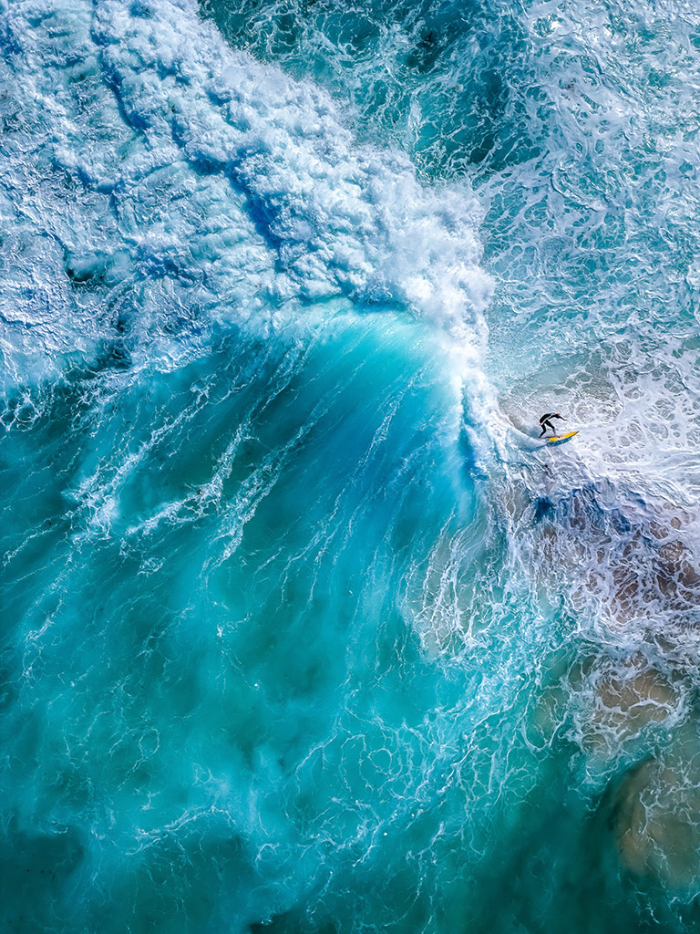 drone shot down over waves crashing around a surfer apoy 2024 action winner