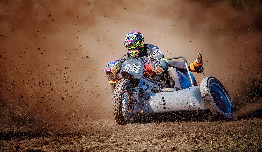 motorsport captured mid action with dirt flying