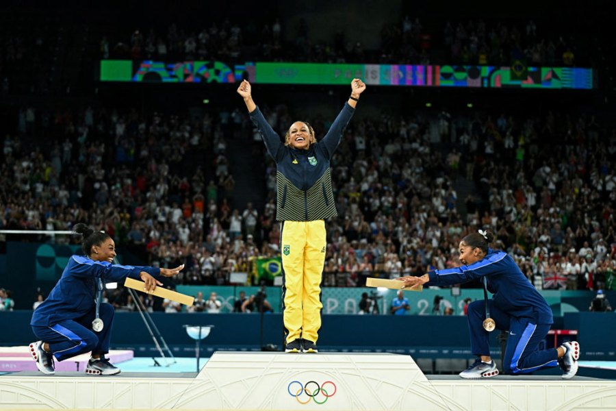 TOPSHOT - (LtoR) US' Simone Biles (silver), Brazil's Rebeca Andrade (gold) and US' Jordan Chiles (bronze) pose during the podium ceremony for the artistic gymnastics women's floor exercise event of the Paris 2024 Olympic Games at the Bercy Arena in Paris, on August 5, 2024.