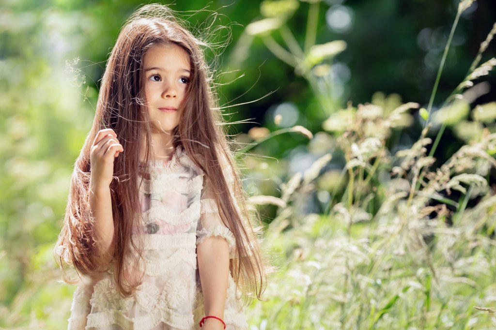 portrait of a little girl in a meadow