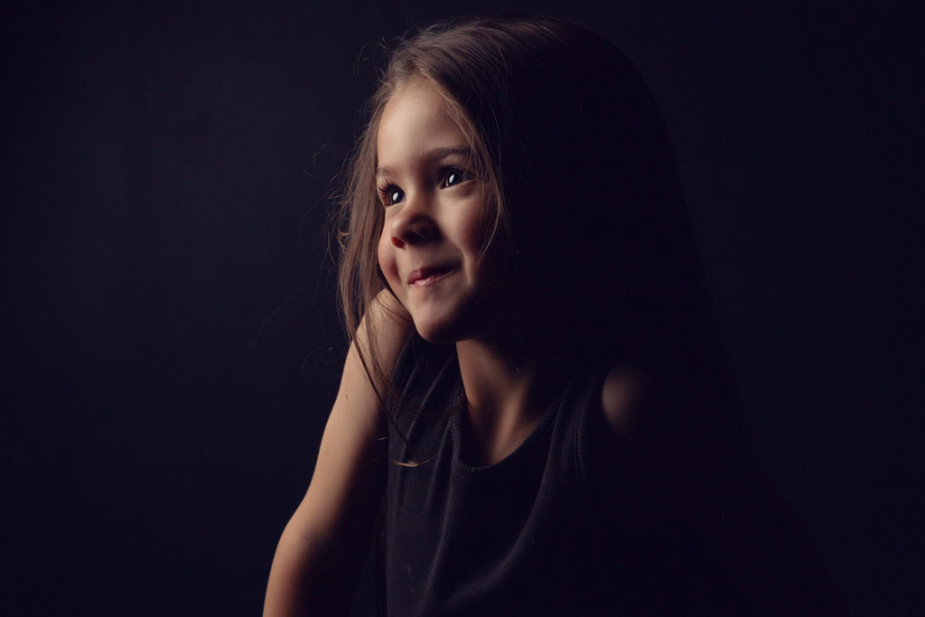 low key portrait of a little girl