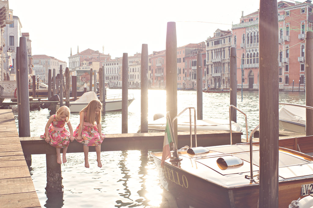 portrait focal lengths, two little girl sitting on apier in Venice