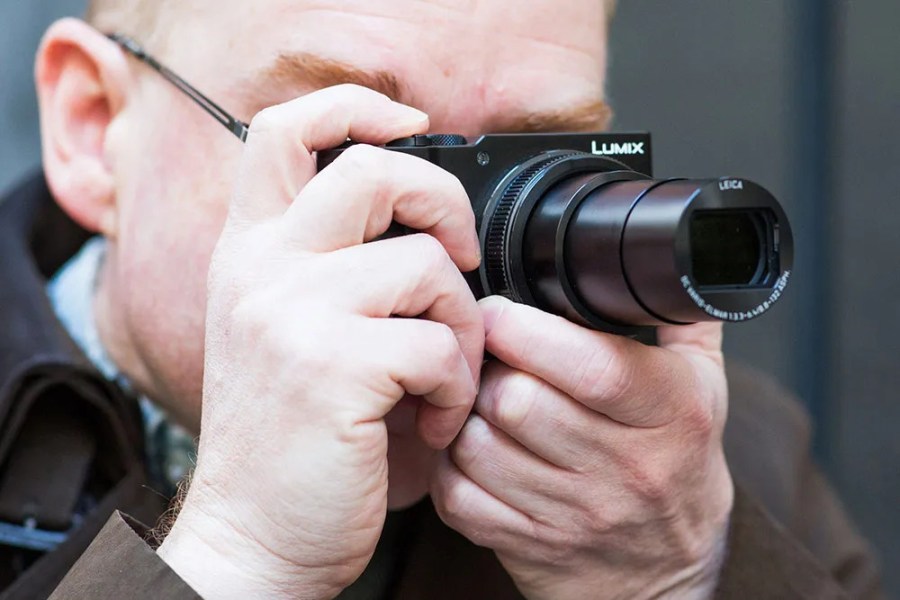 AP technical editor Andy Westlake aiming and shooting with the Panasonic Lumix TZ200, one of the best cameras for travel