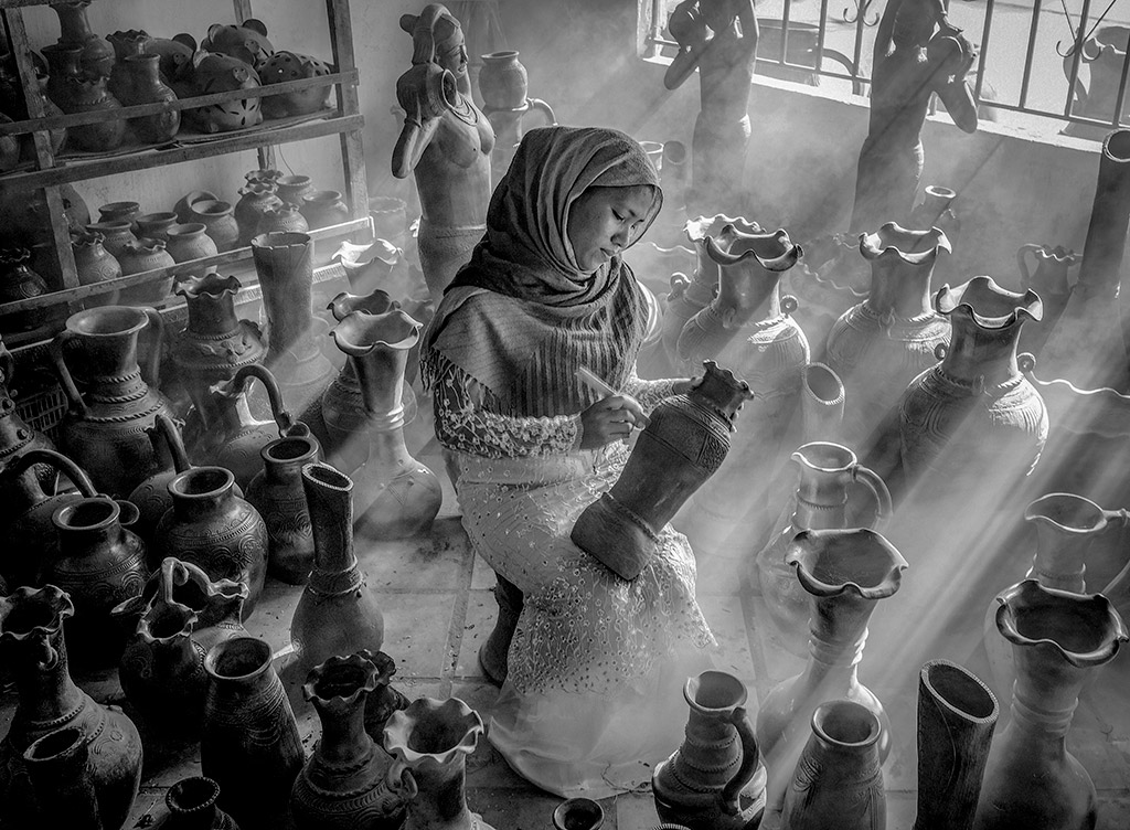 black and white photo awards Portait Category:
Winner: Van Dong Nguyen - Pottery village girl
An artisan specializes in handmade pottery in Bau Truc village, Ninh Thuan province (Vietnam), a craft village recognized by UNESCO as a world intangible heritage.