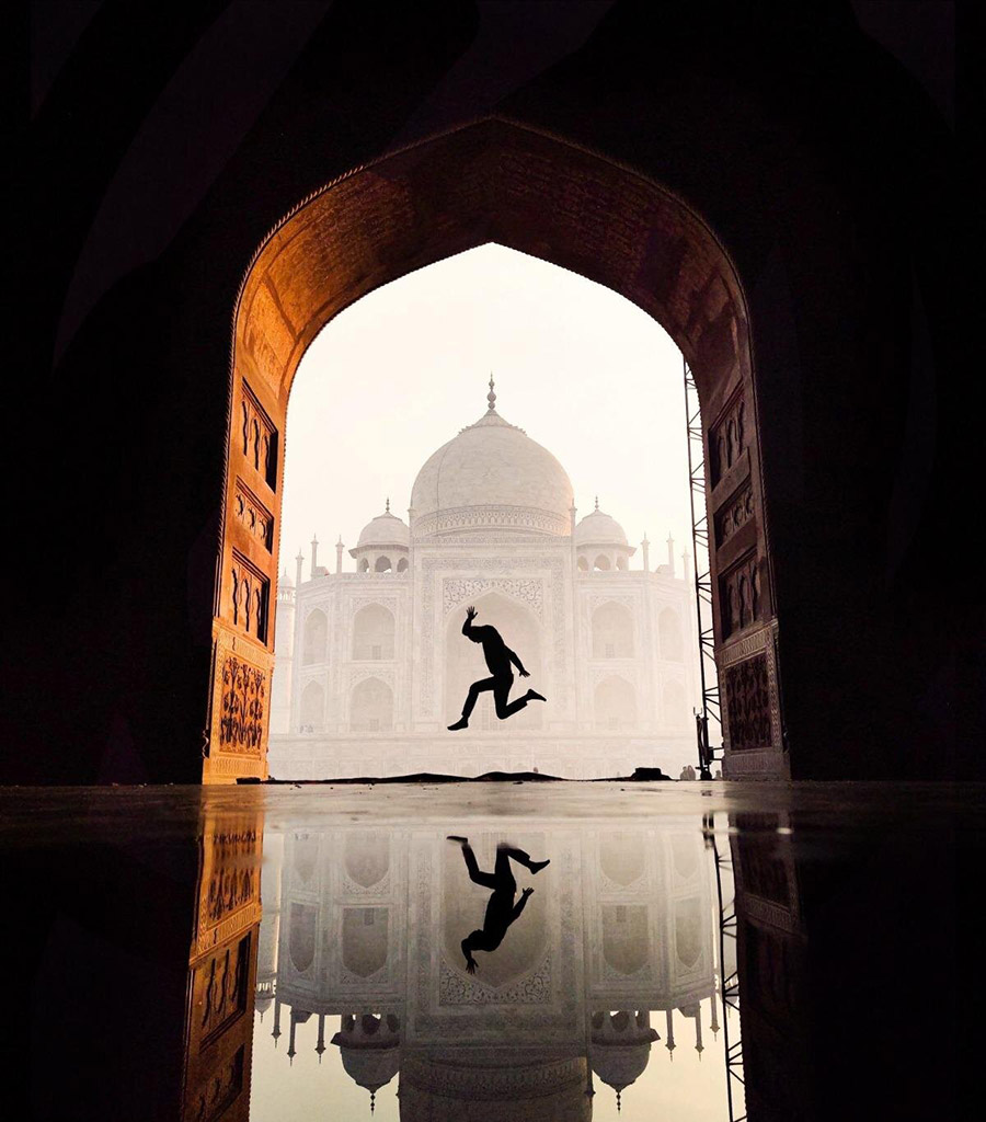 person jumping infront of the Taj Mahal young apoy action winner