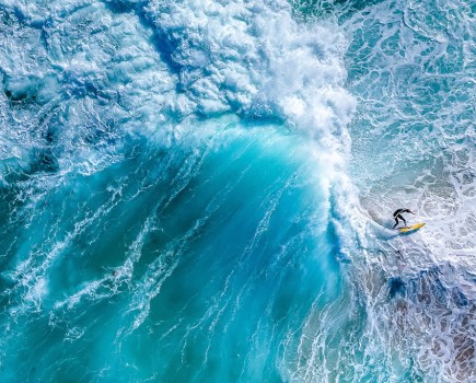 drone shot down over waves crashing around a surfer apoy 2024 action winner