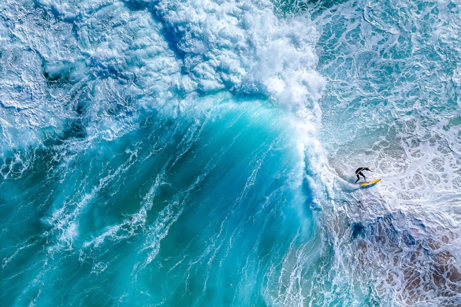 drone shot down over waves crashing around a surfer apoy 2024 action winner