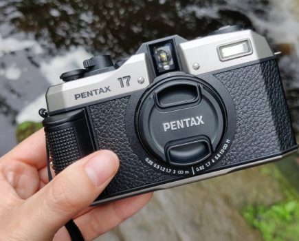 pentax 17 with lens cap on in hand