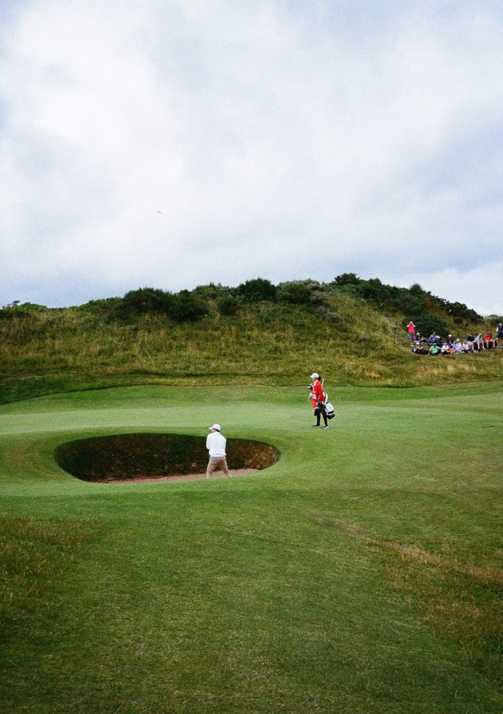 golfer playing a shot at a bunker taken on film Kodak UltraMax 400 Image: Jessica Miller