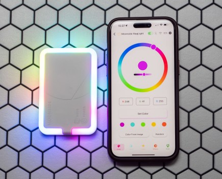 The Moonside MagLight next to an iPhone 15 Pro Max with the Moonside app open