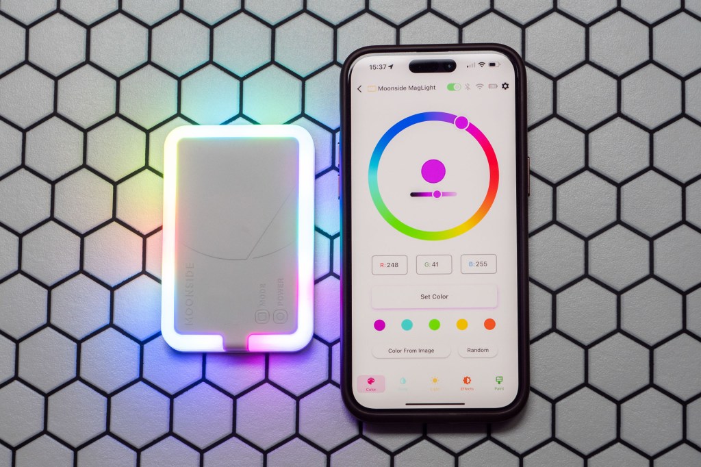 The Moonside MagLight next to an iPhone 15 Pro Max with the Moonside app open