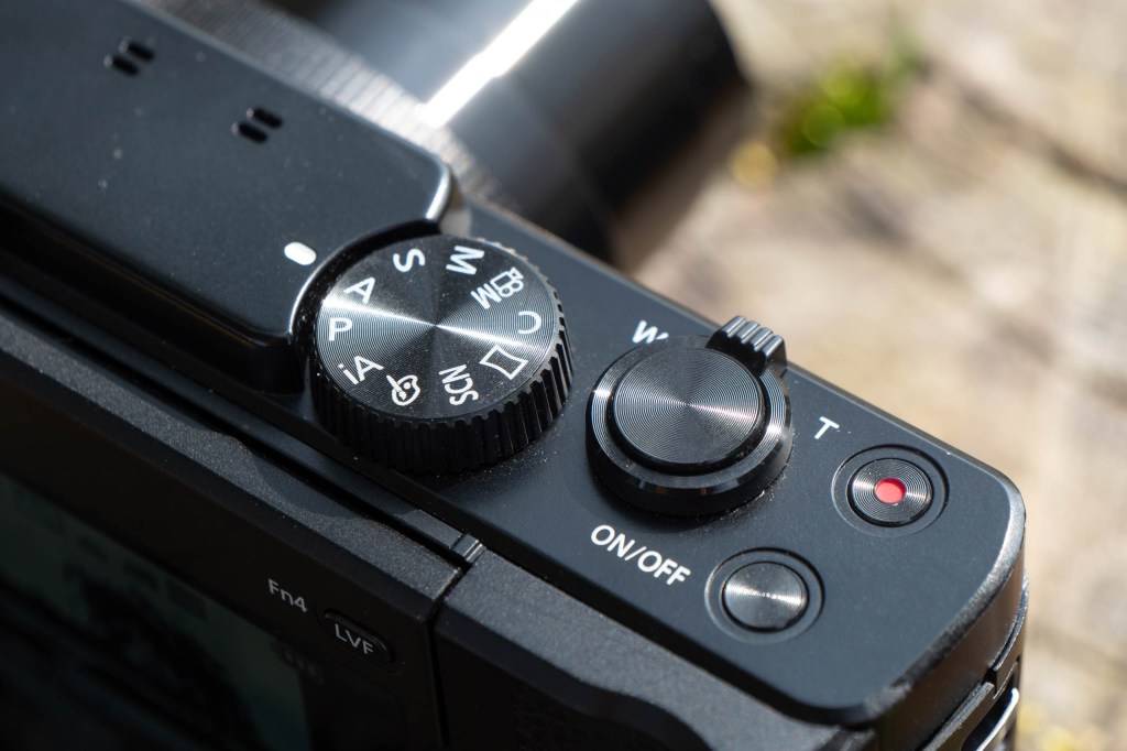 The mode dial, zoom rocker and shutter release button of the TZ95. 