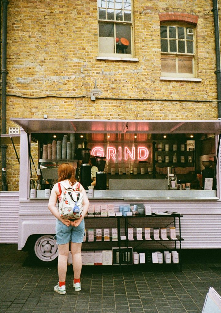 photo of person waiting at grind coffee van