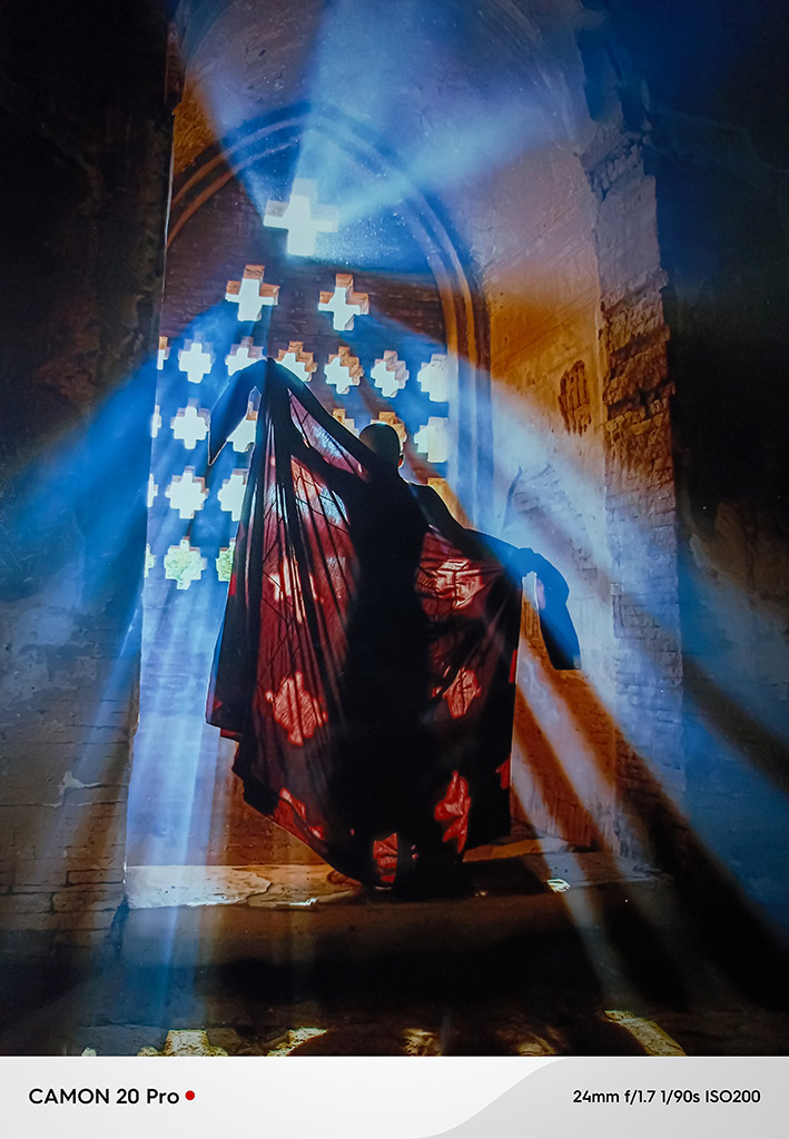 This captivating image showcases a silhouette of a monk standing within a dimly lit Bagan ancient pagoda.