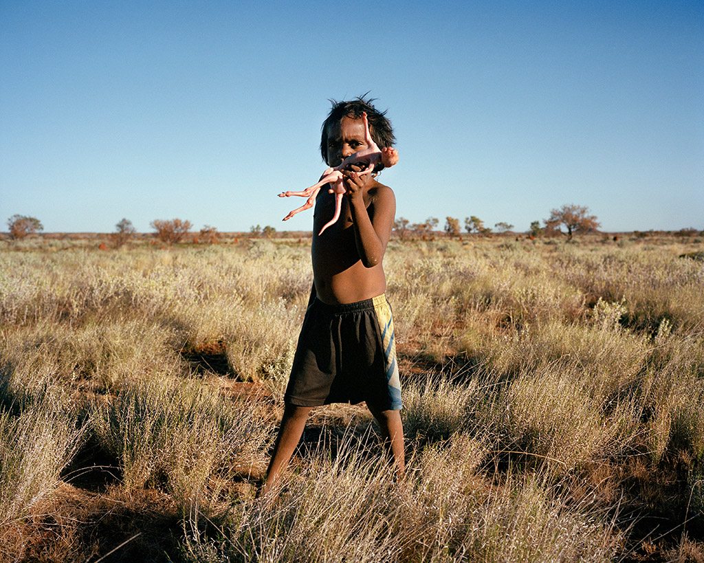 ; Kukatja Pintupi boy Matthew West, hunting trip, Wirrimanu/Balgo, 
Kukatja Country, Western Australia, 2023 © Adam Ferguson. 
