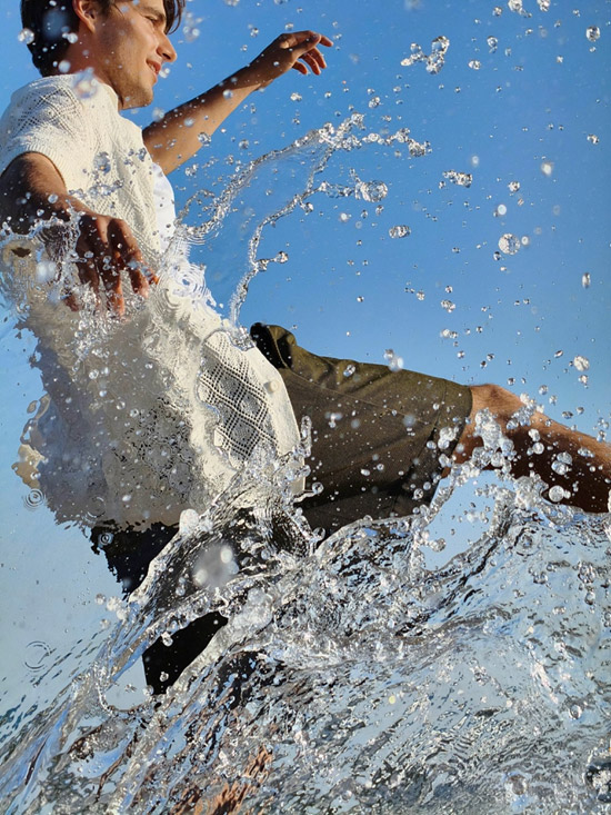 man splashing water 