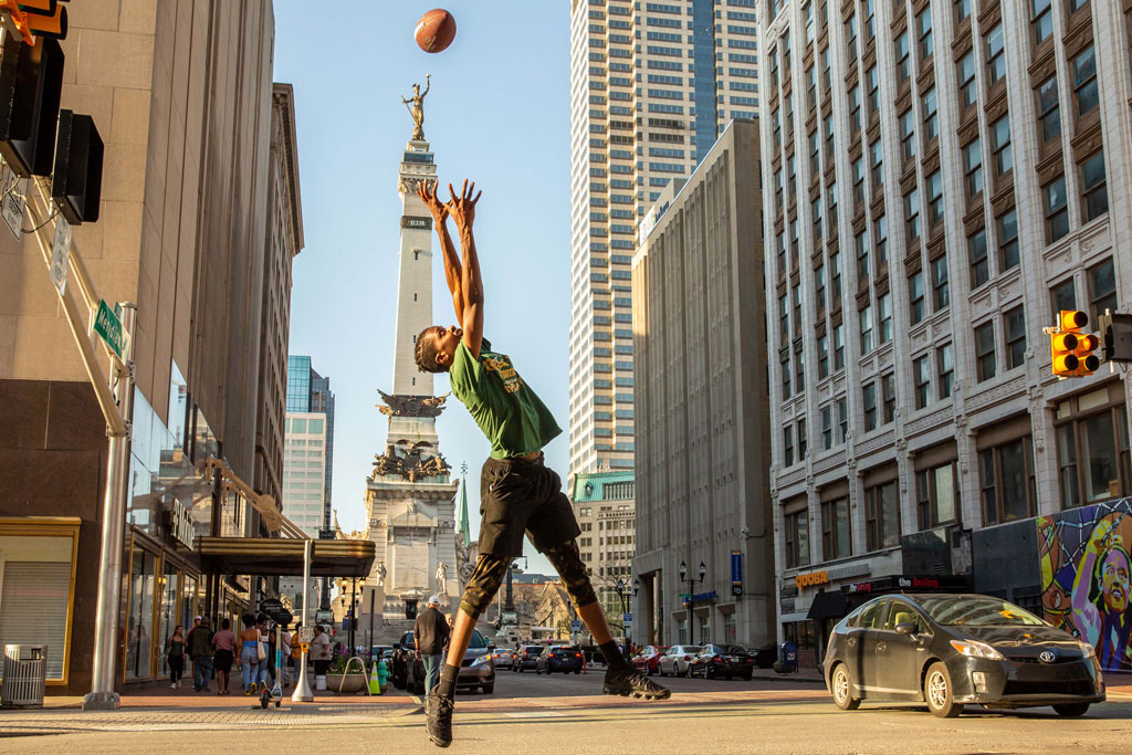 Indianapolis a boy jumps up to catch a basketball