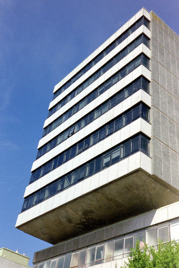 image of a six storey concrete building shot on an Olympus Mju II