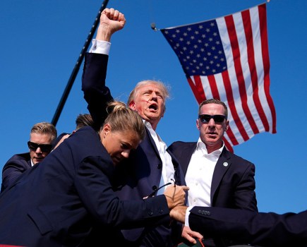 Republican presidential candidate former President Donald Trump is surrounded by U.S. Secret Service agents at a campaign rally, Saturday, July 113, 2024, in Butler. ©AP Photo/Evan Vucci