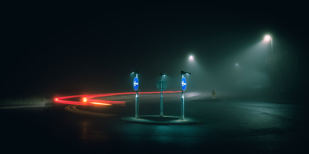 traffic trail at night around roundabout