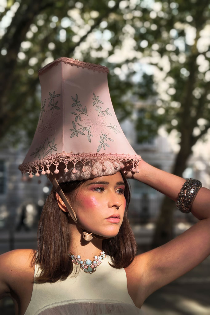 Motorola Edge 50 sample image, portrait of a woman with a pink lampshade