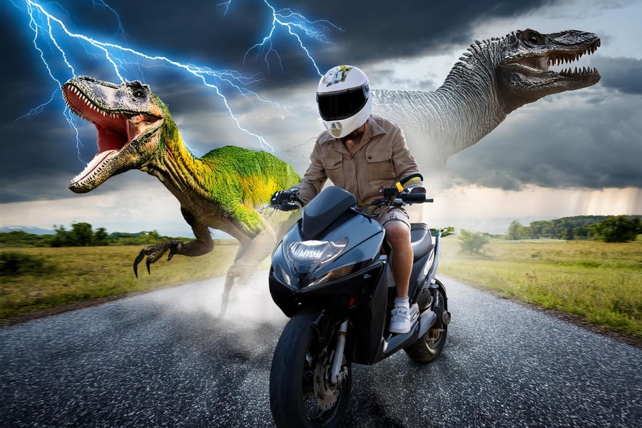 Adobe Generative AI image, generated with the prompt "Man riding moped on road being chased by lightning and dinosaurs." This example is being used as Adobe were advertising this kind of image as a reason why you'd want to use generative AI.