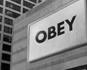 OBEY sign from the film They Live. The wheels of capitalism and consumerism are difficult to avoid. Image: They Live (1988 film).