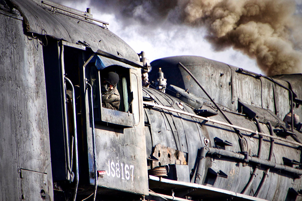 old steam train and its drivers