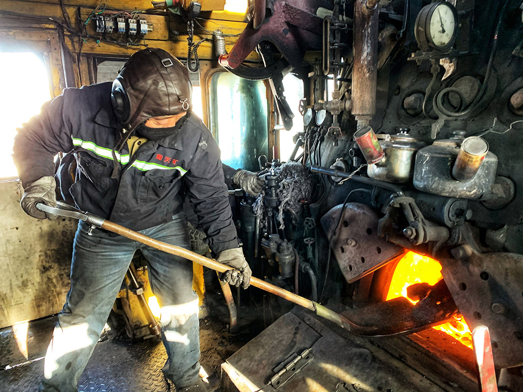 old steam train and its drivers