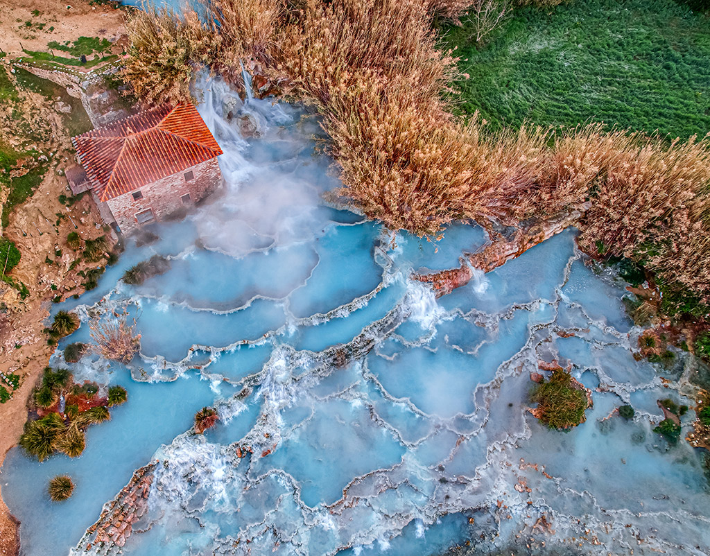 drone photo of thermal waters of Cascate del Mulino in Tuscany