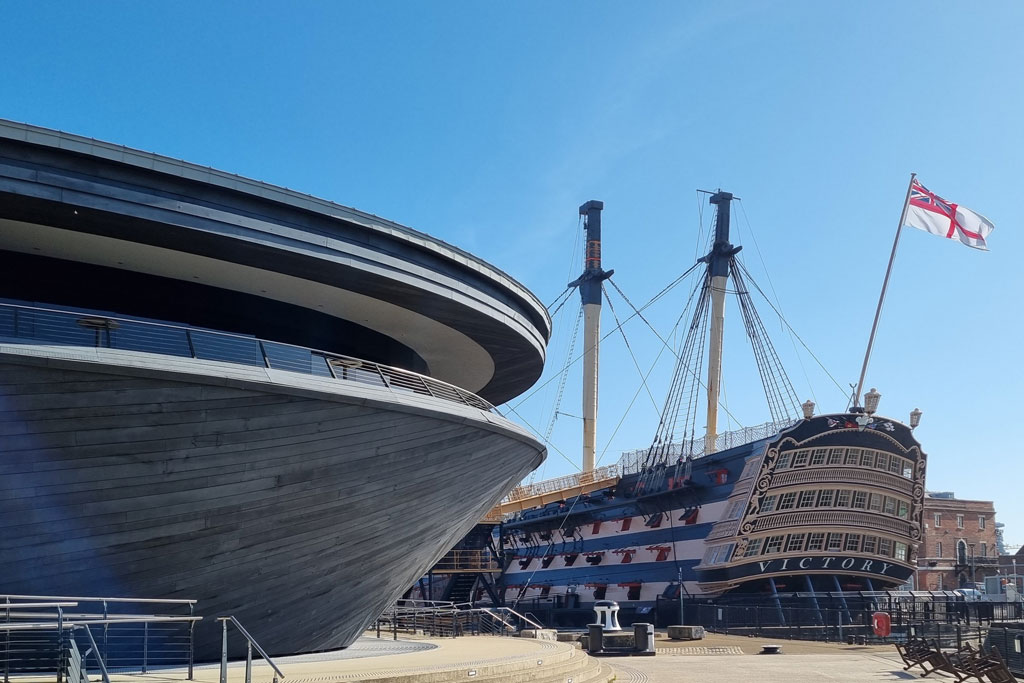 Old sailing ship in a modern dockyard