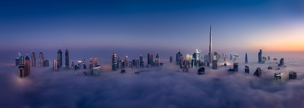 A
panoramic
view
of
Downtown
Dubai,
Business
Bay,
and
the
Sheikh
Zayed
Road
skyline
