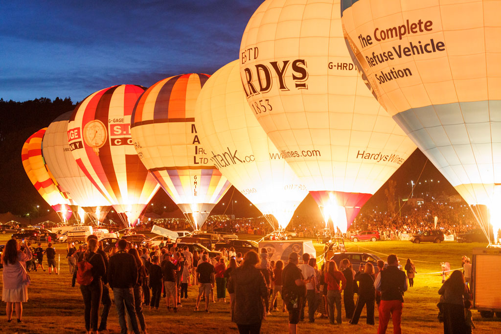 Hot air balloons before take off, illuminted at night