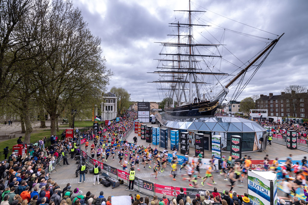 London Marathon participants run past the Cutty Sark in Greenwich