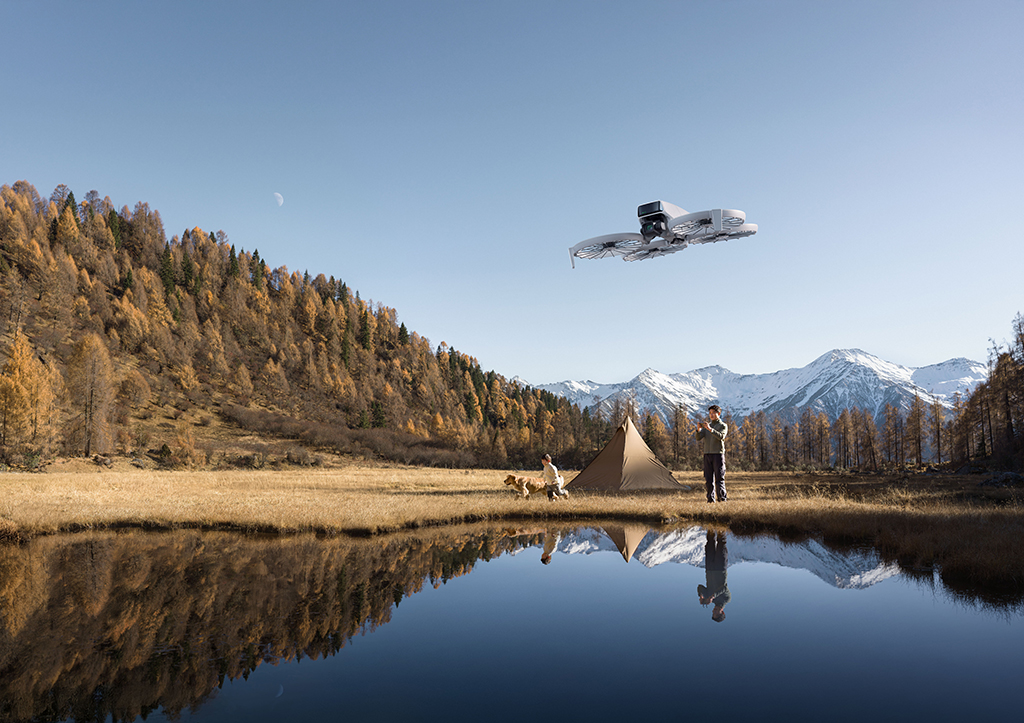 DJI drone in flight over a lake