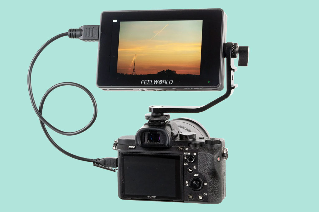 Freeworld F6 Plus Field monitor mounted on a camera