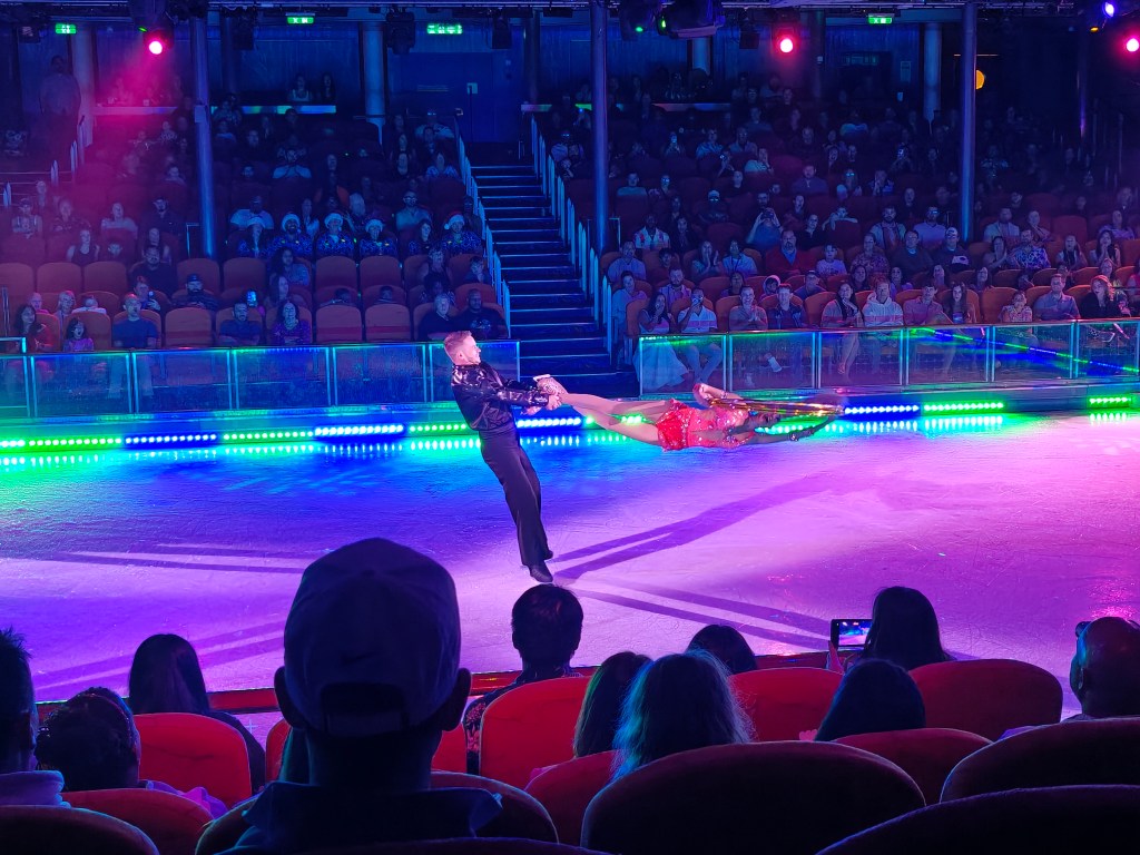 two ice dancers mid performance