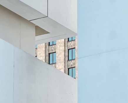 the Palace of Culture and Science emerges from a window created by the Museum of Modern Art