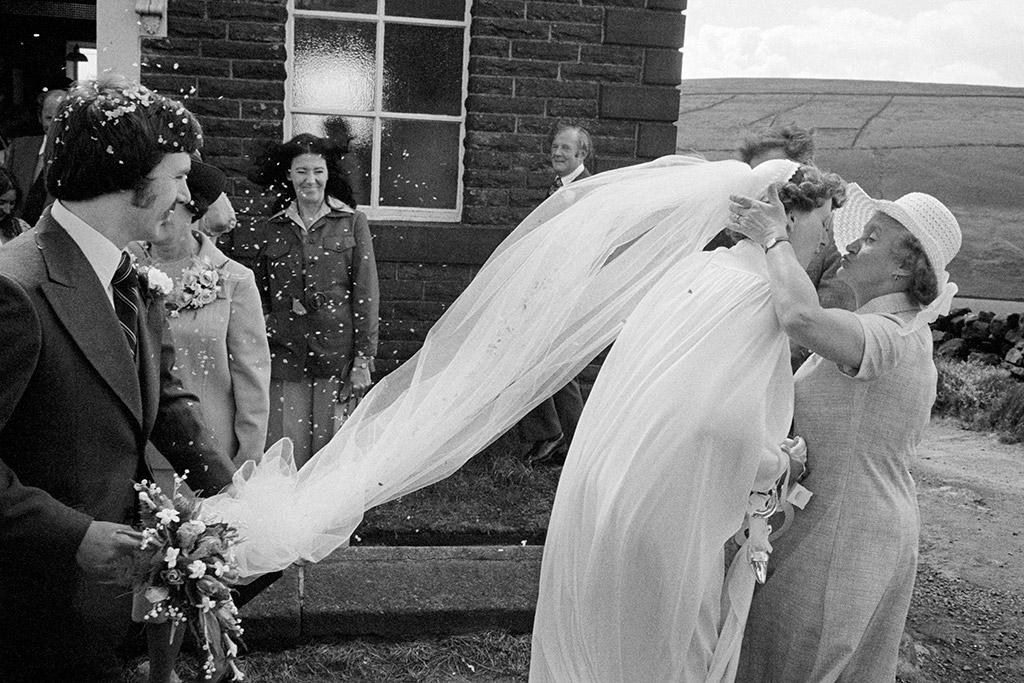 black and white wedding photo bride greeting woman