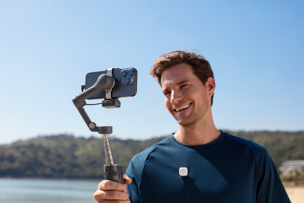 Man holding DJI Osmo Mobile 7P gimbal