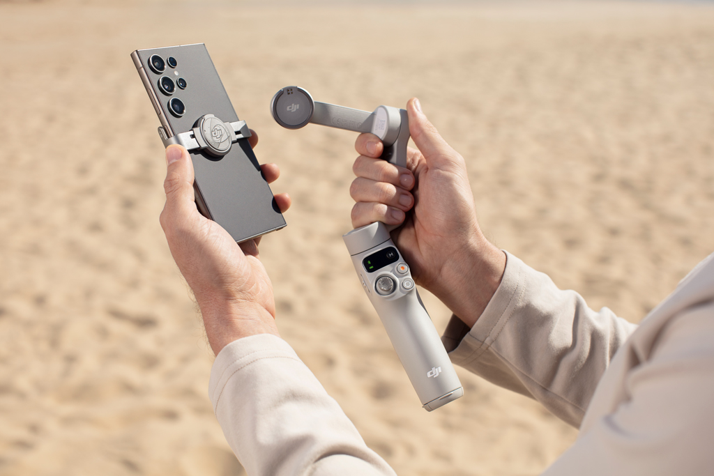 DJI Osmo Mobile 7 Gimbal in hands showing the gimbal from the back