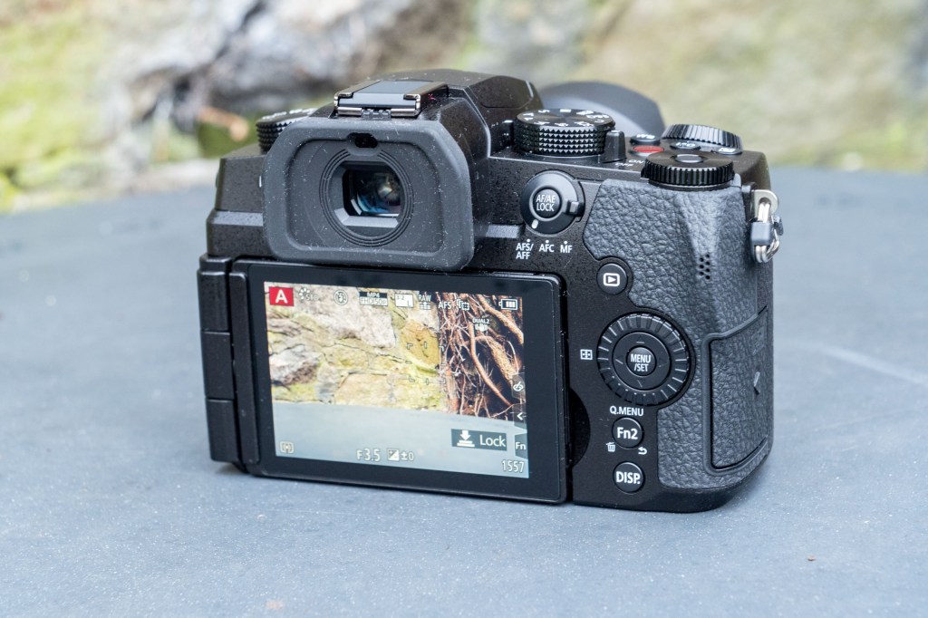 Panasonic Lumix G97 on a metal table, rear view