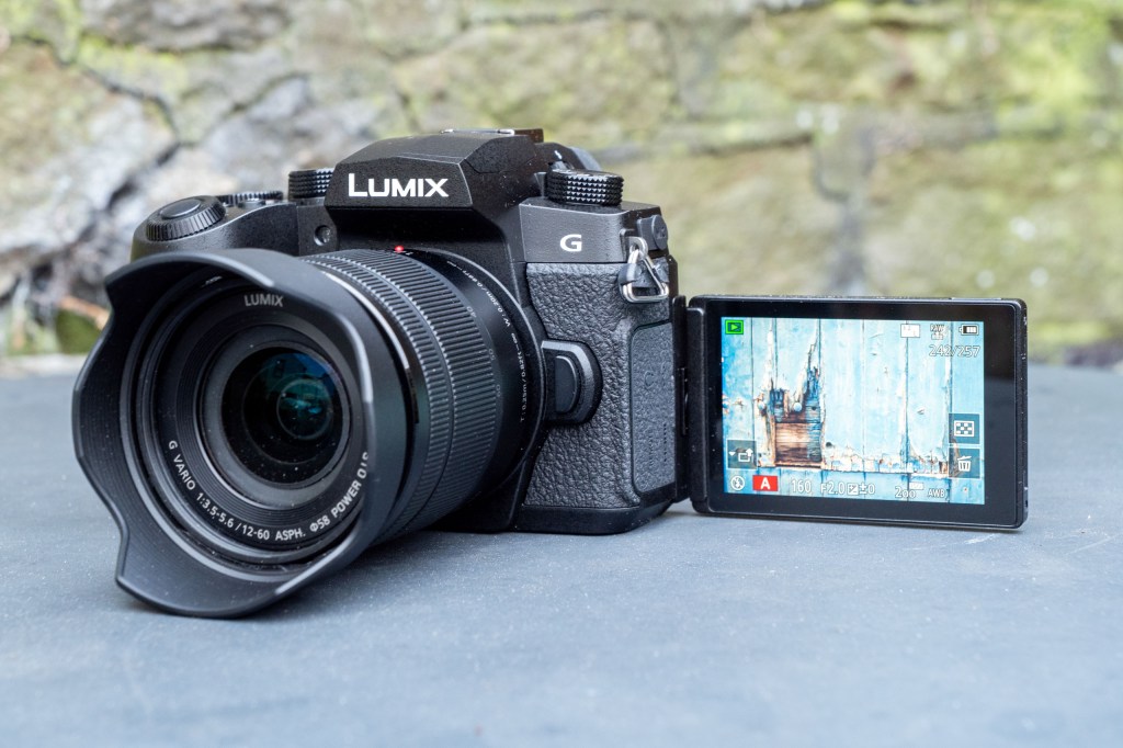 Panasonic Lumix G97 on a metal table, with the screen facing forward