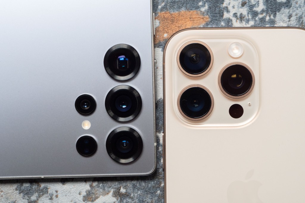 A close up of the lenses of the Samsung Galaxy S25 Ultra and the iPhone 16 Pro