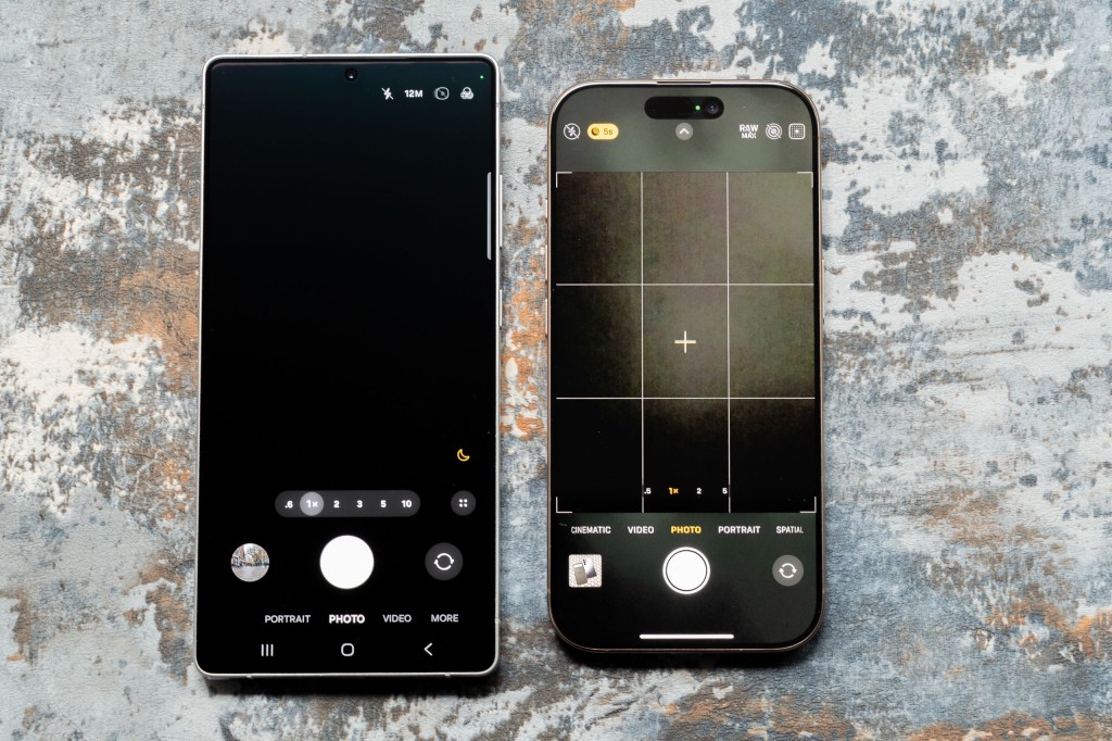 The Samsung Galaxy S25 Ultra next to the iPhone 16 Pro with the screens switched on